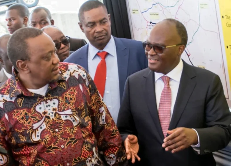 FILE photo of Retired President Uhuru Kenyatta with former Transport CS James Macharia