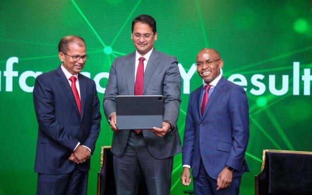 Safaricom Board Chair Adil Khawaja(center) and (left) Safaricom CEO Peter Ndegwa