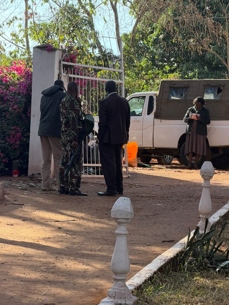 Uniformed and armed officers manning the property