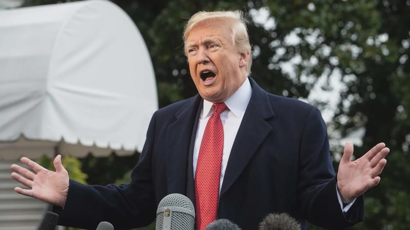 Donald Trump speaks to reporters outdoors.
