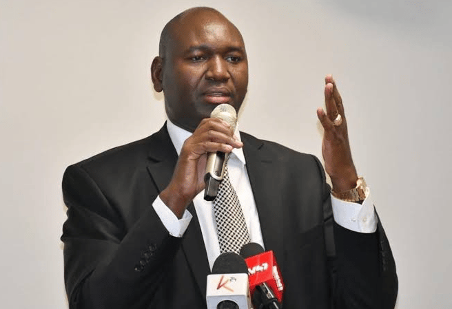An image of PS Education, Julius Bitok, speaking at a past event.