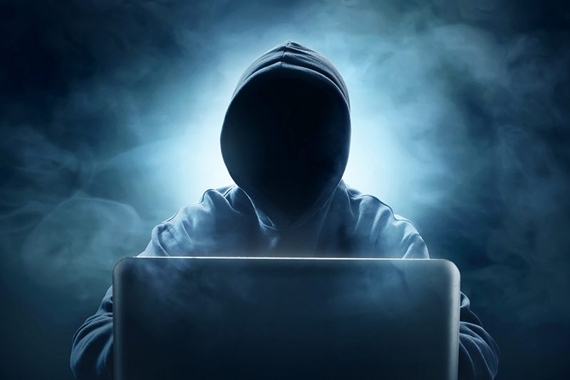 Hacker using laptop