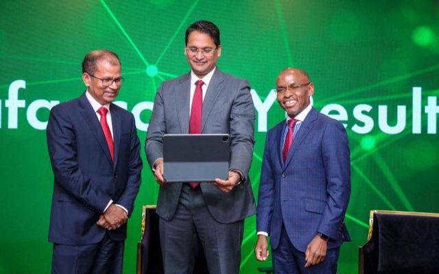 Safaricom Board Chair Adil Khawaja(center) and (left) Safaricom CEO Peter Ndegwa