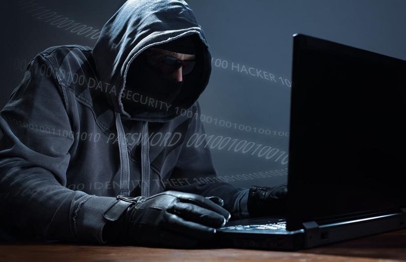 Computer-hacker-stealing-data-ecard