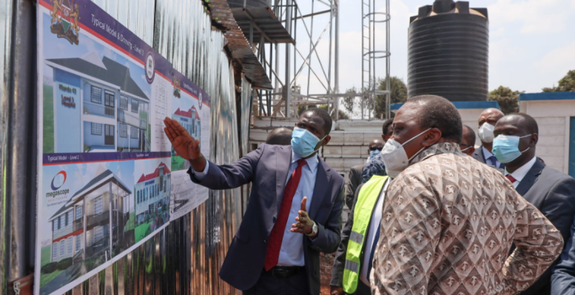 President Uhuru Kenyatta alongside KMPDU Secretary General Dr Ouma Oluga during the commissioning of the project.